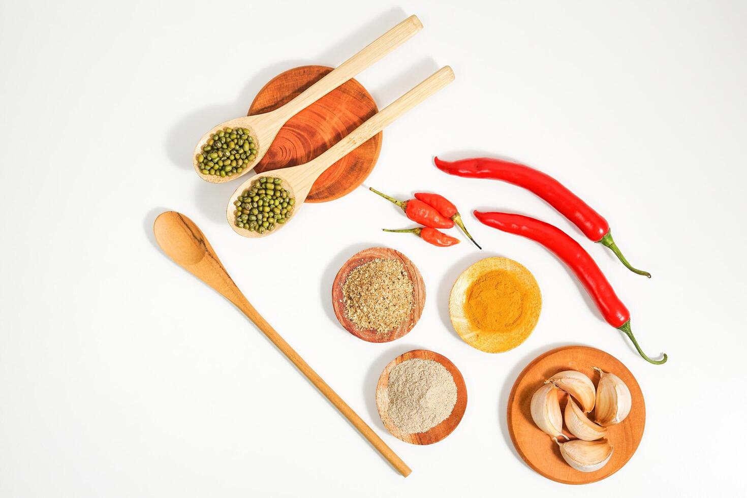 variety of spices and herbs prepared on the white table. food condiment recipes from the top view. suitable for social media or website background presentation. photo