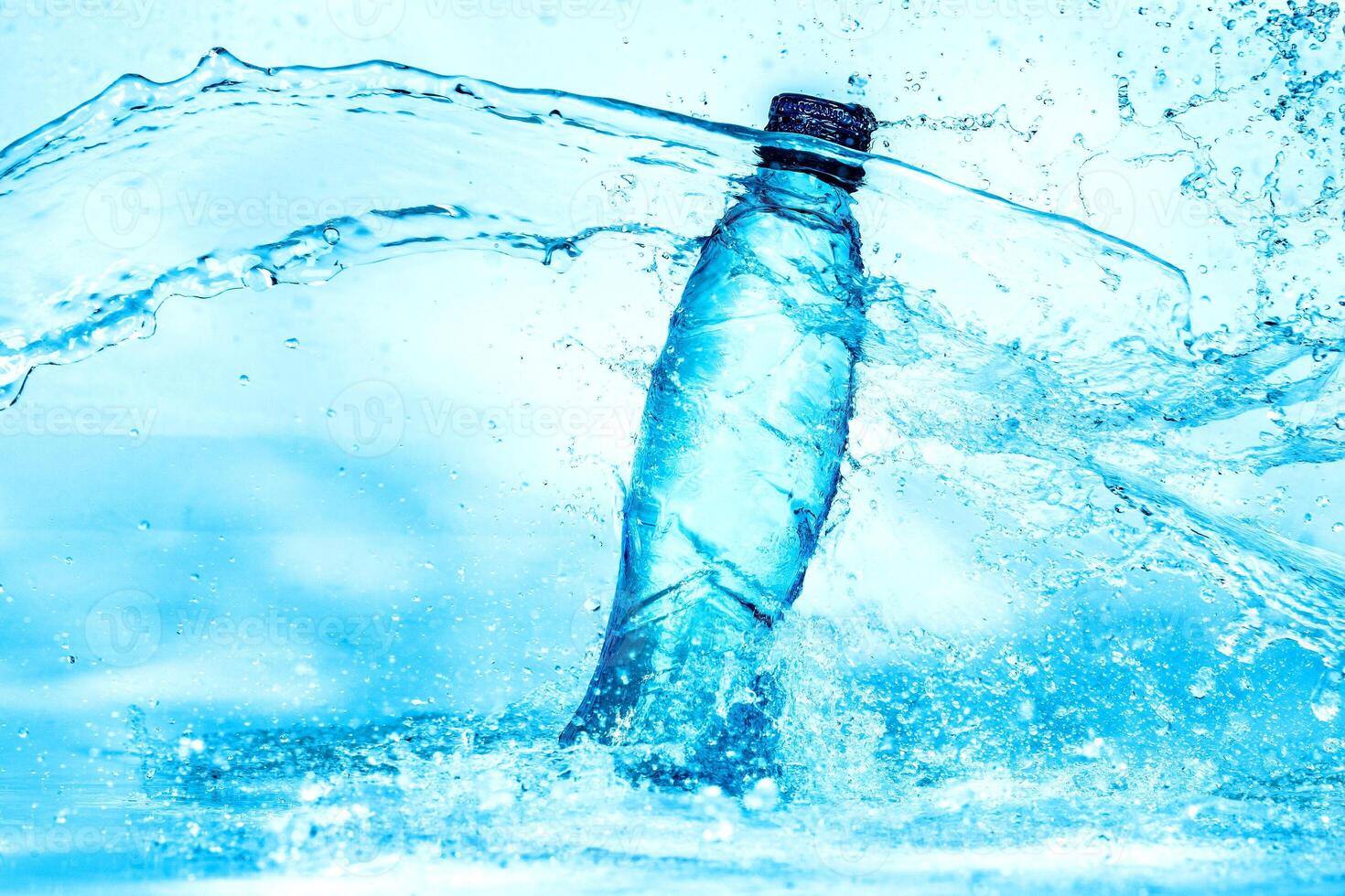 light blue transparent water wave surface with splash bubble on bottle water. photo