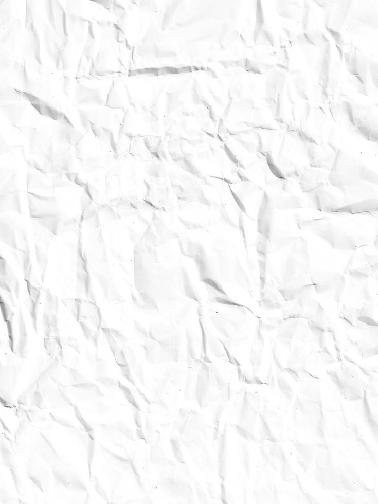 crumpled paper in white color. realistic creased paper page. damaged texture in abstract. wrinkled background material. photo