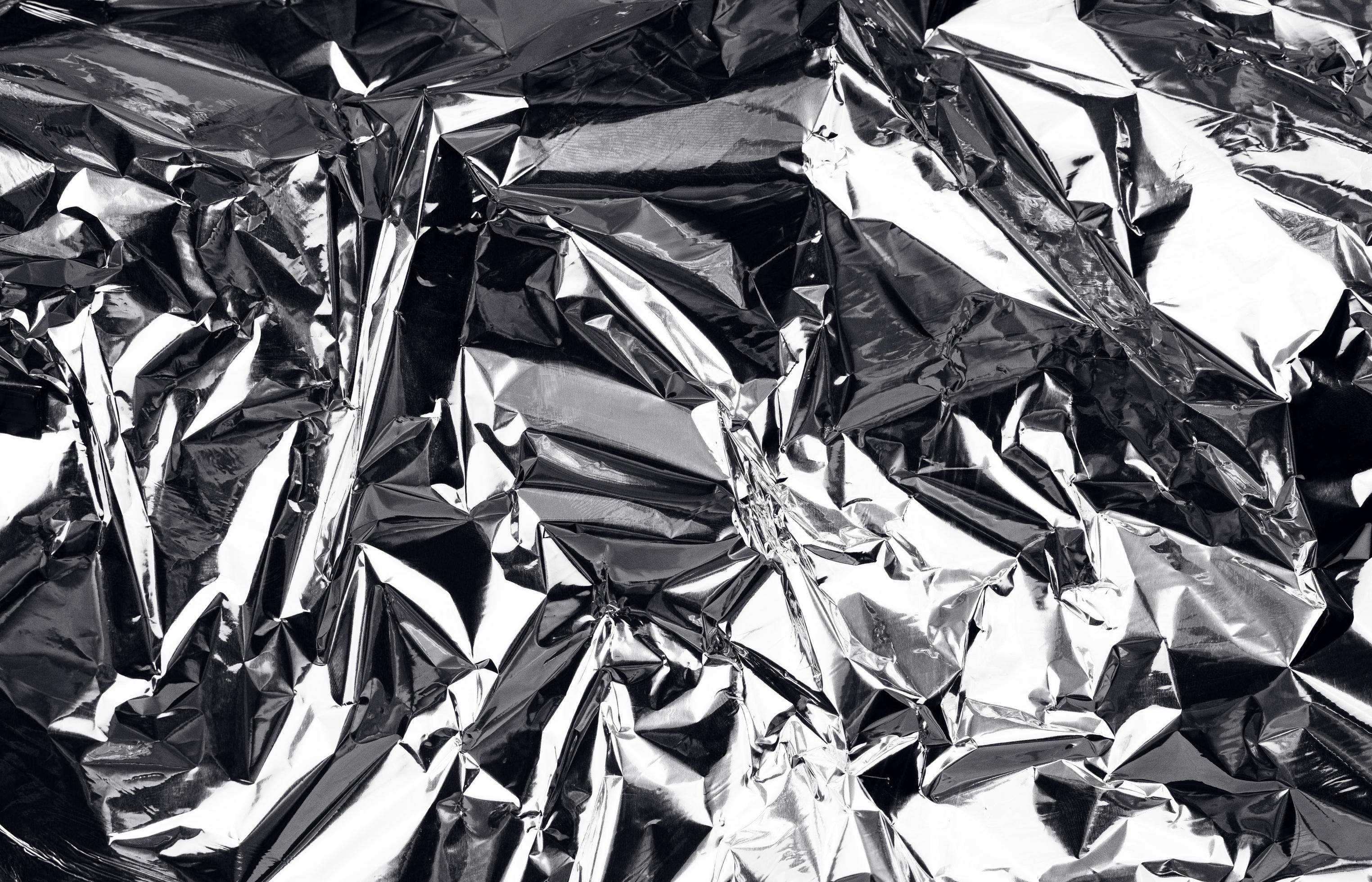 https://static.vecteezy.com/system/resources/previews/004/687/558/large_2x/crumpled-aluminum-foil-background-wrinkled-shiny-silver-foil-for-decoration-creative-design-element-in-shabby-shape-abstract-texture-surface-from-wrapping-paper-free-photo.jpg