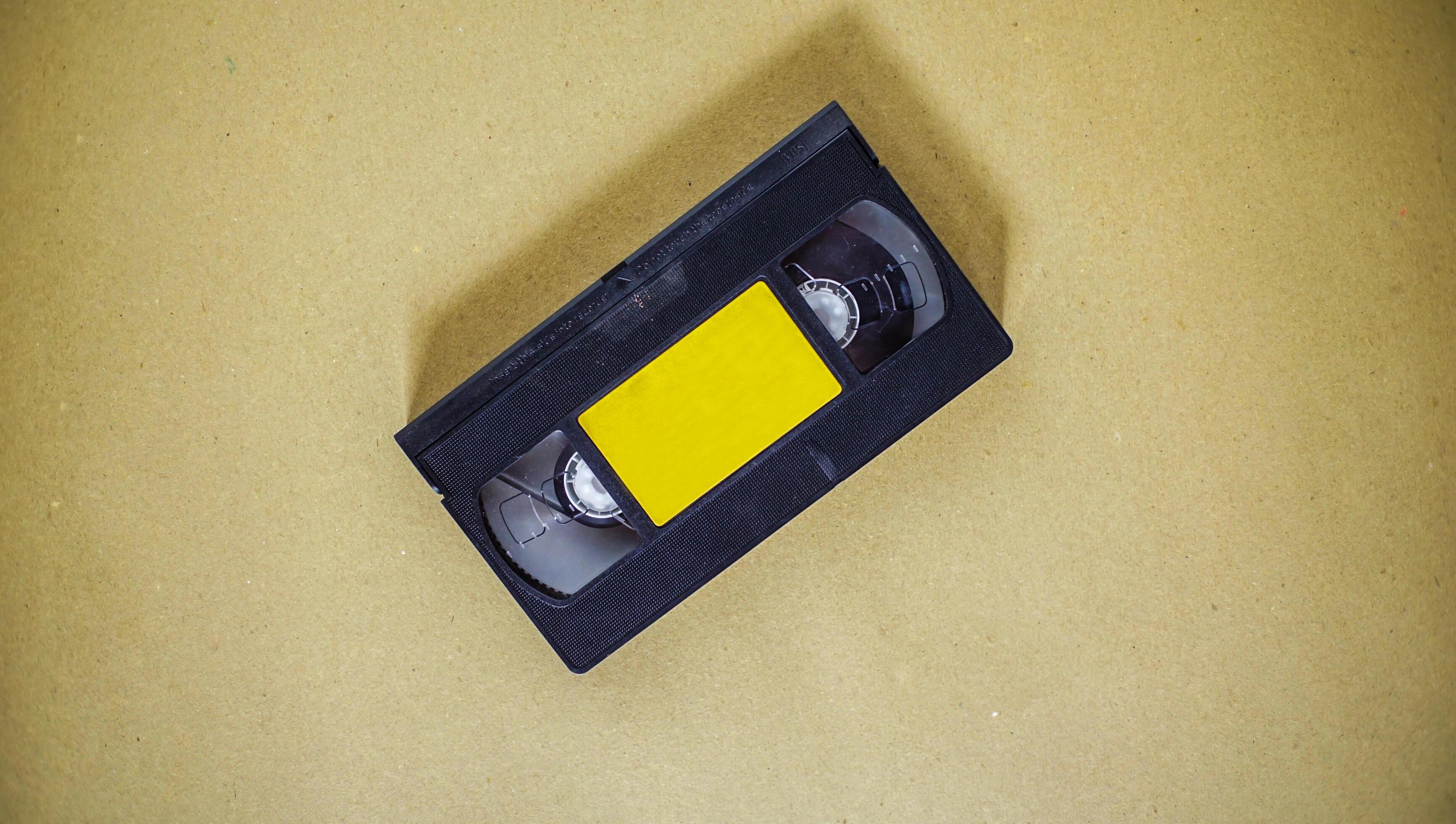 an old audio cassette has a yellow label. stuff to record and store
