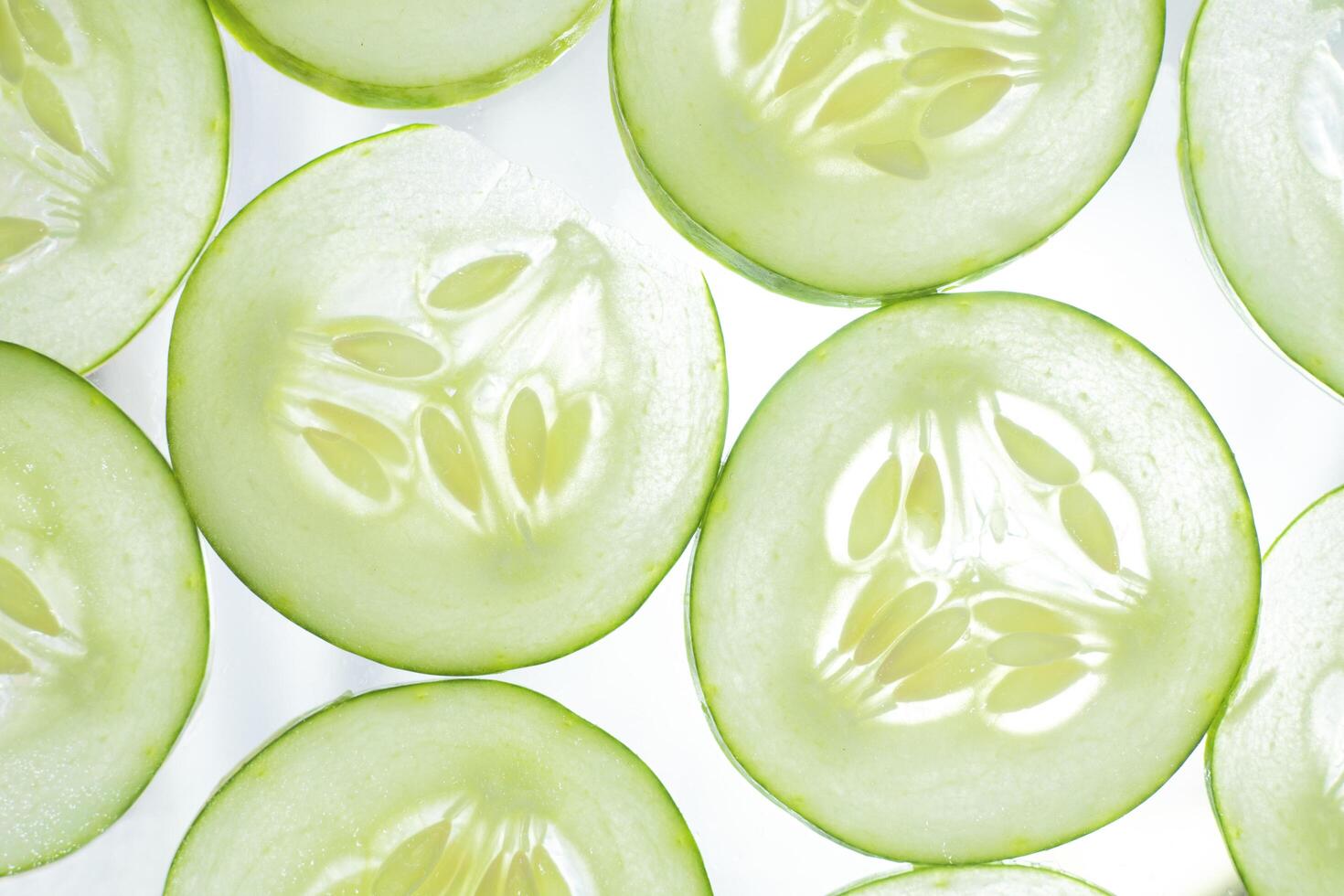 fresh cucumber slices background. collection of fruit and vegetable pattern background. natural green background in full frame. photo