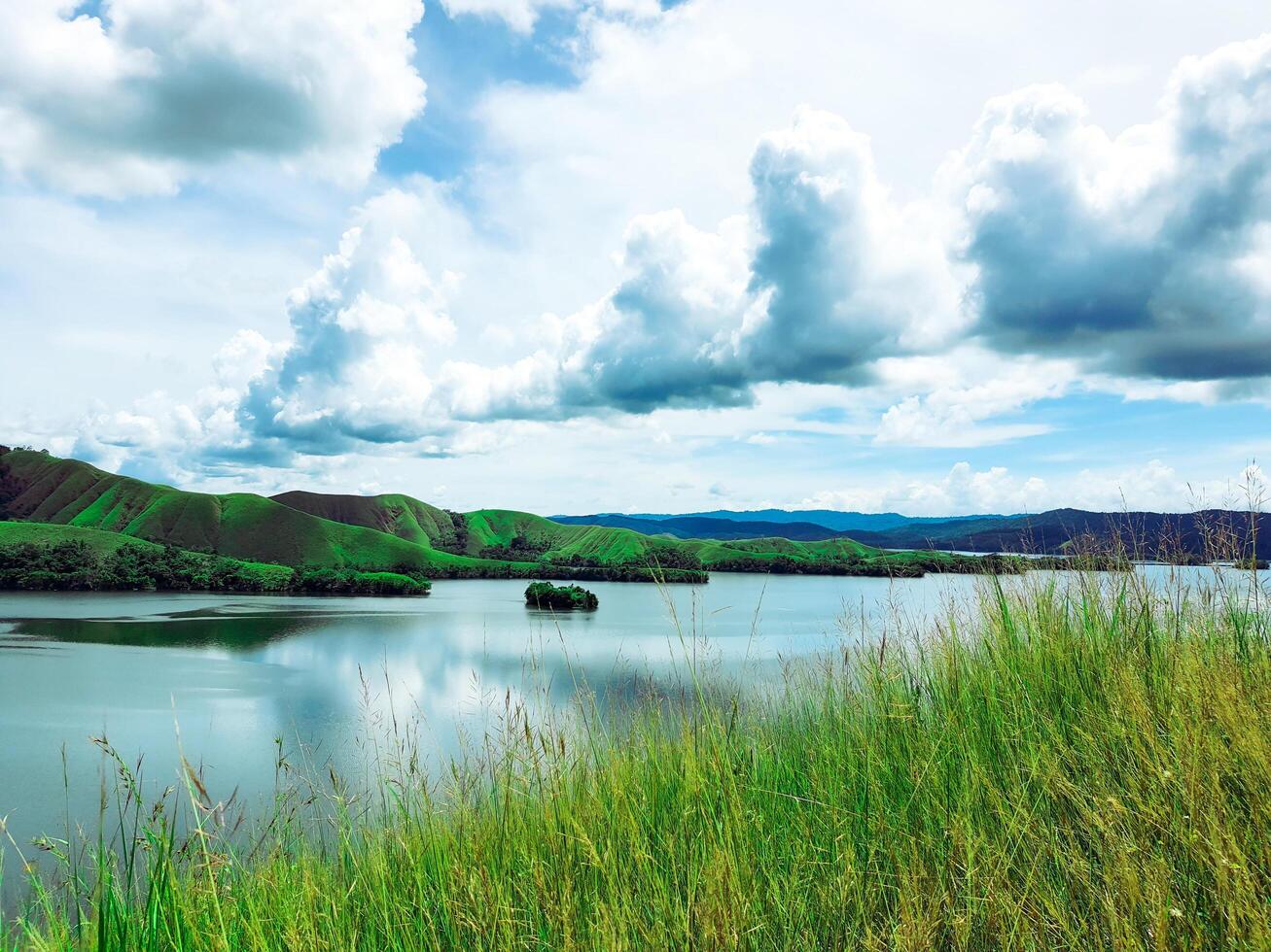 beautiful scenery in highlands. a lake among the mountains. greenish background as a fresh, joyful, fair, clear and calm weather in meadow. photo