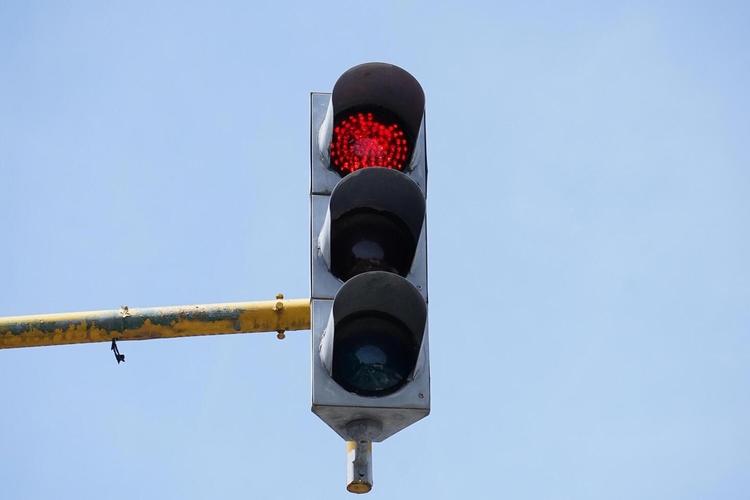 a traffic light in red. modern traffic lamp at the crossroad. photo