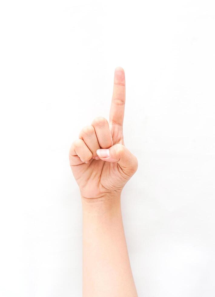 a hand gesture showing an index finger pointing up, meaning one or exclamation. collection of the sign language using hand gestures. photo