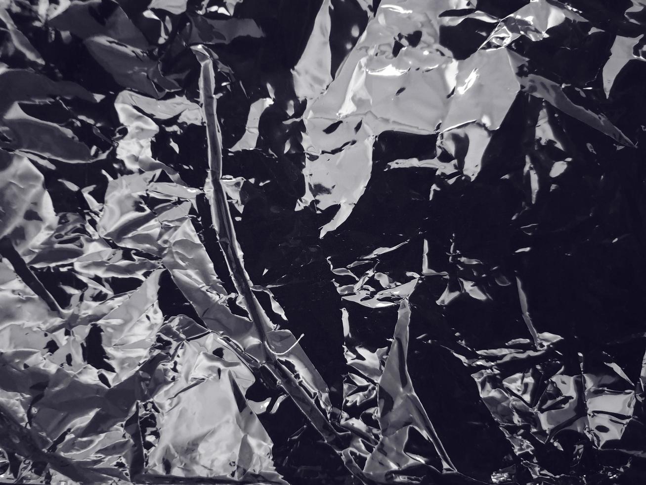 Detalle de la textura plástica de urdimbre en blanco y negro para el fondo. plástico grunge con reflejo de luz suave foto