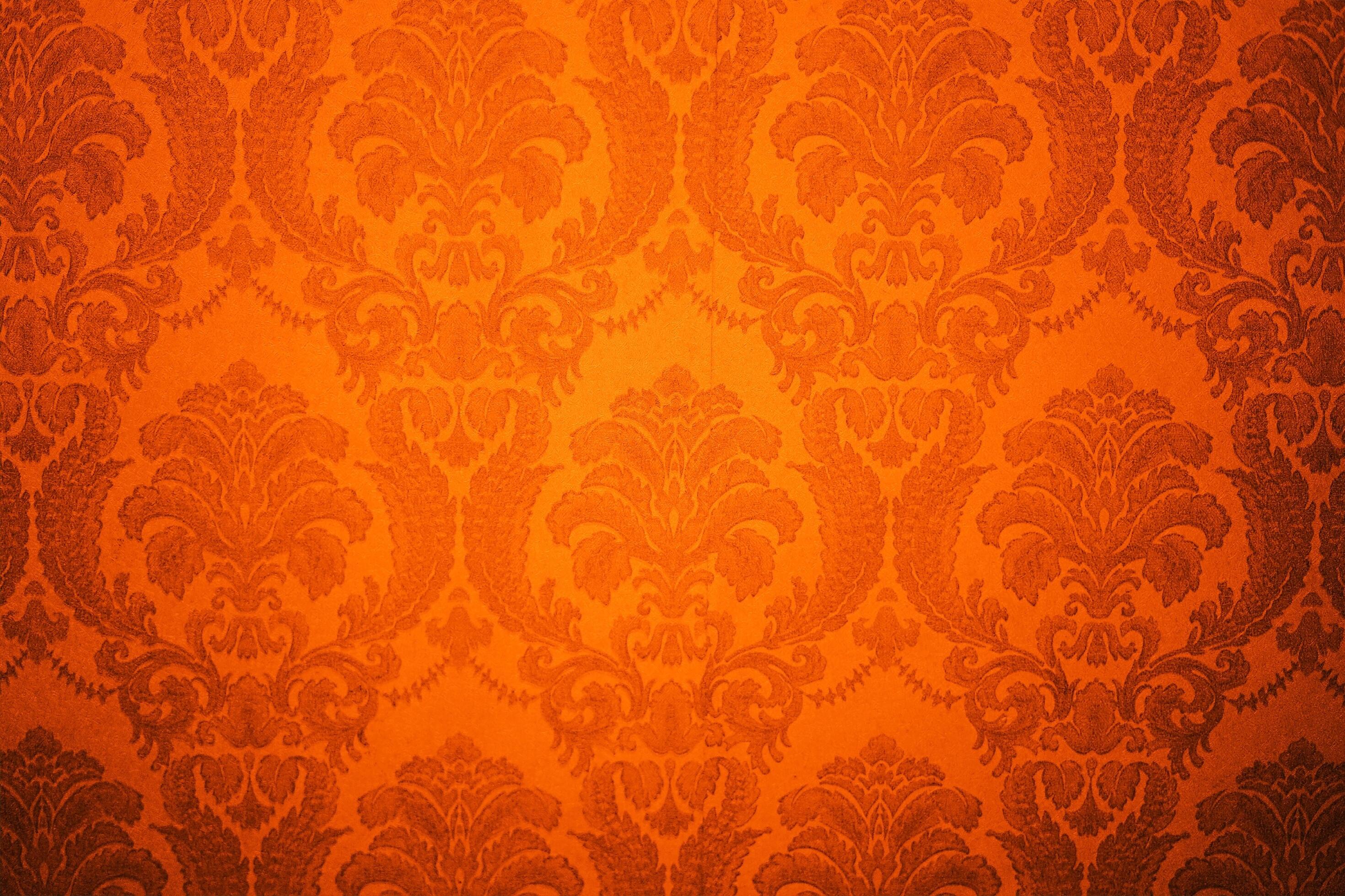 Damask wallpaper pattern. Abstract background with orange color. Damask