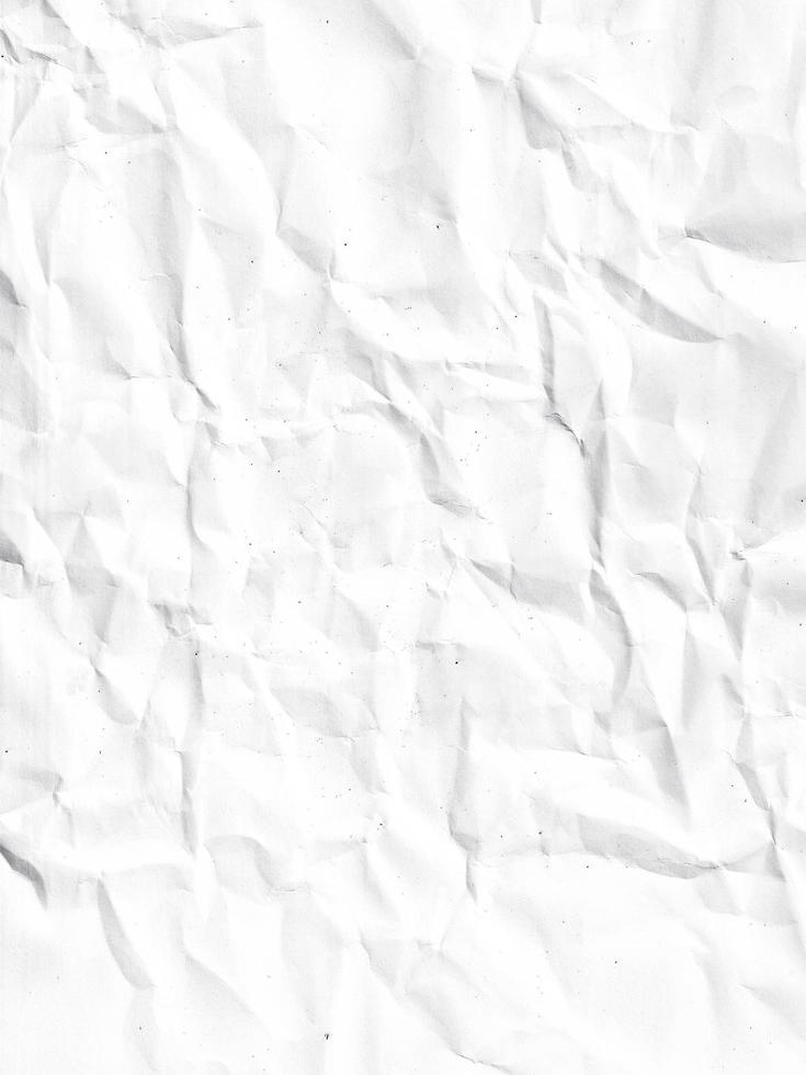 crumpled paper in white color. realistic creased paper page. damaged texture in abstract. wrinkled background material. photo