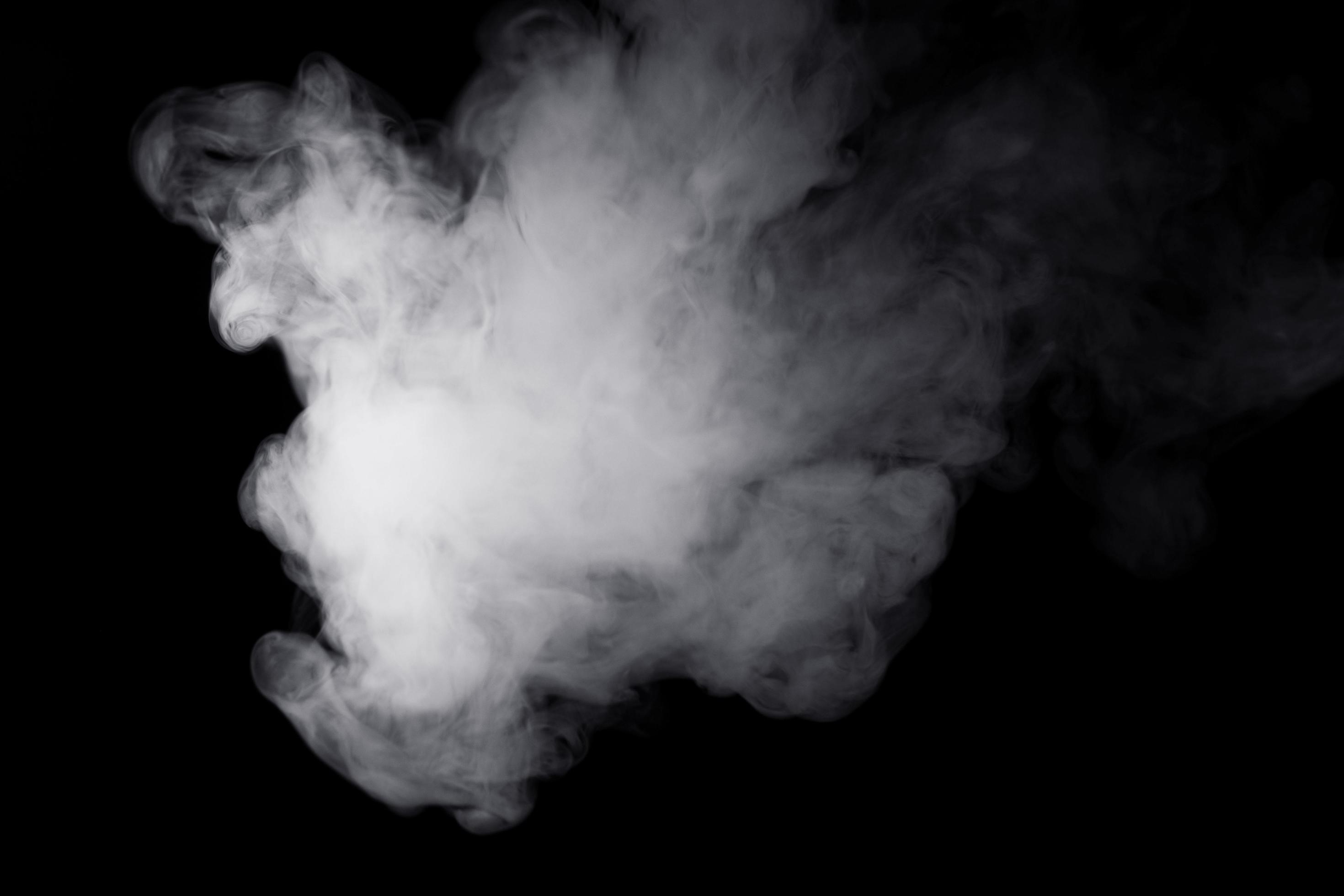 white smoke on black background for overlay effect. a realistic smoke effect  for creating an intense nuance in a photo 4690378 Stock Photo at Vecteezy