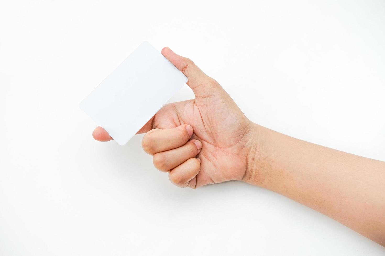 hand holds an empty white space on a white background. a card mockup that is suitable for business or identity mockup use. photo