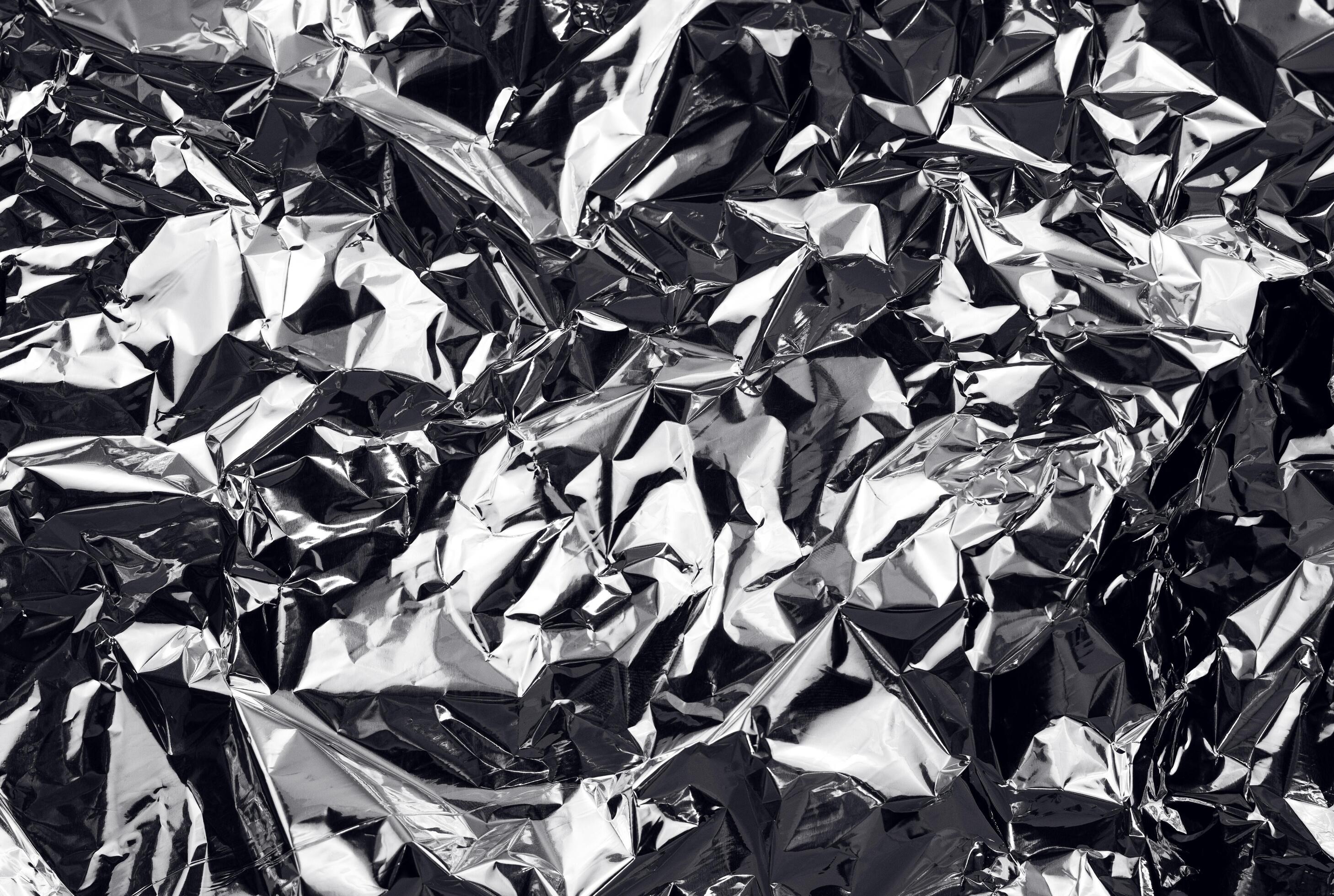 https://static.vecteezy.com/system/resources/previews/004/690/845/large_2x/crumpled-aluminum-foil-background-wrinkled-shiny-silver-foil-for-decoration-creative-design-element-in-shabby-shape-abstract-texture-surface-from-wrapping-paper-free-photo.jpg