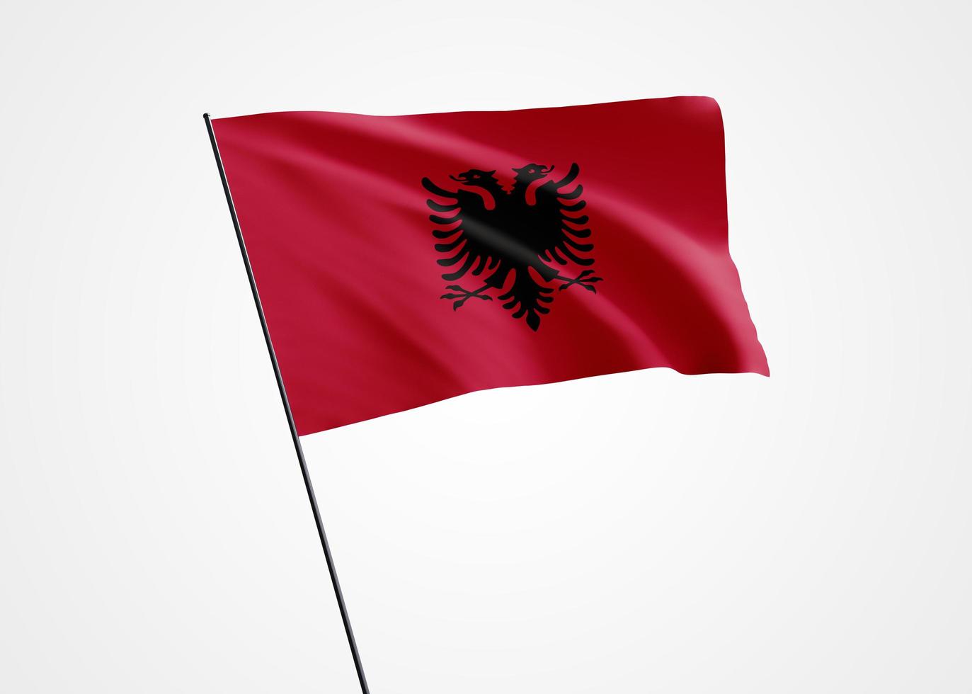 bandera de albania ondeando alto en el fondo aislado. 28 de noviembre día de la independencia de albania. colección de la bandera nacional mundial colección de la bandera nacional mundial foto
