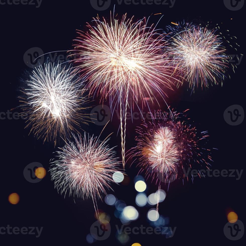 Fireworks with silhouettes beautiful holiday.New Year fireworks Congratulations and celebrate the New Year. photo