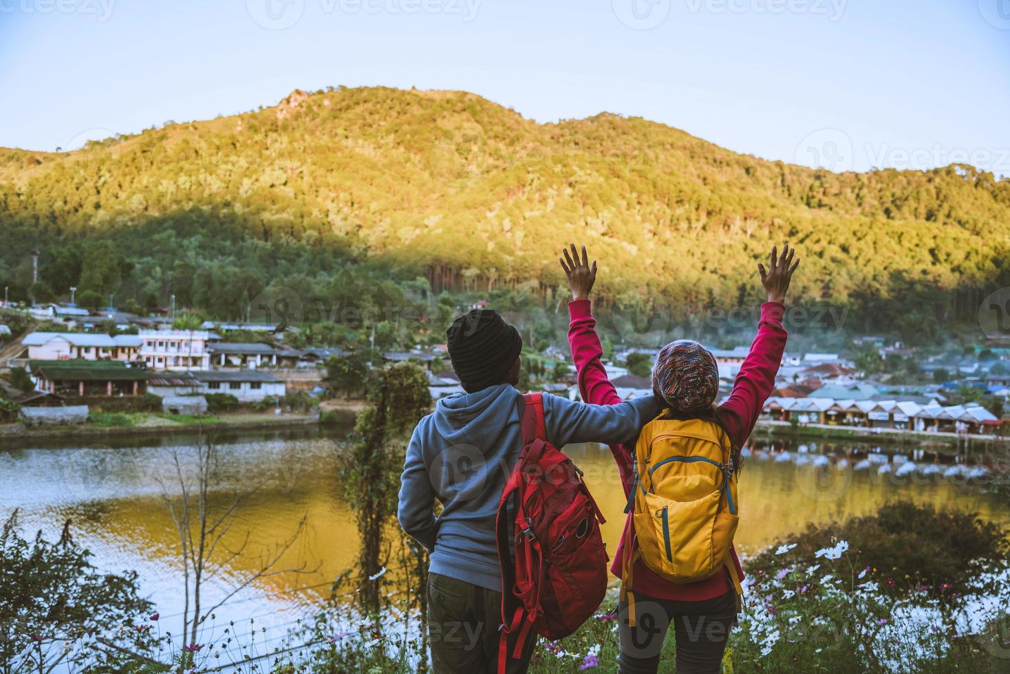 Lover women and men asians travel in the holiday.Travel relax, Natural Touch countryside, in Thailand. photo