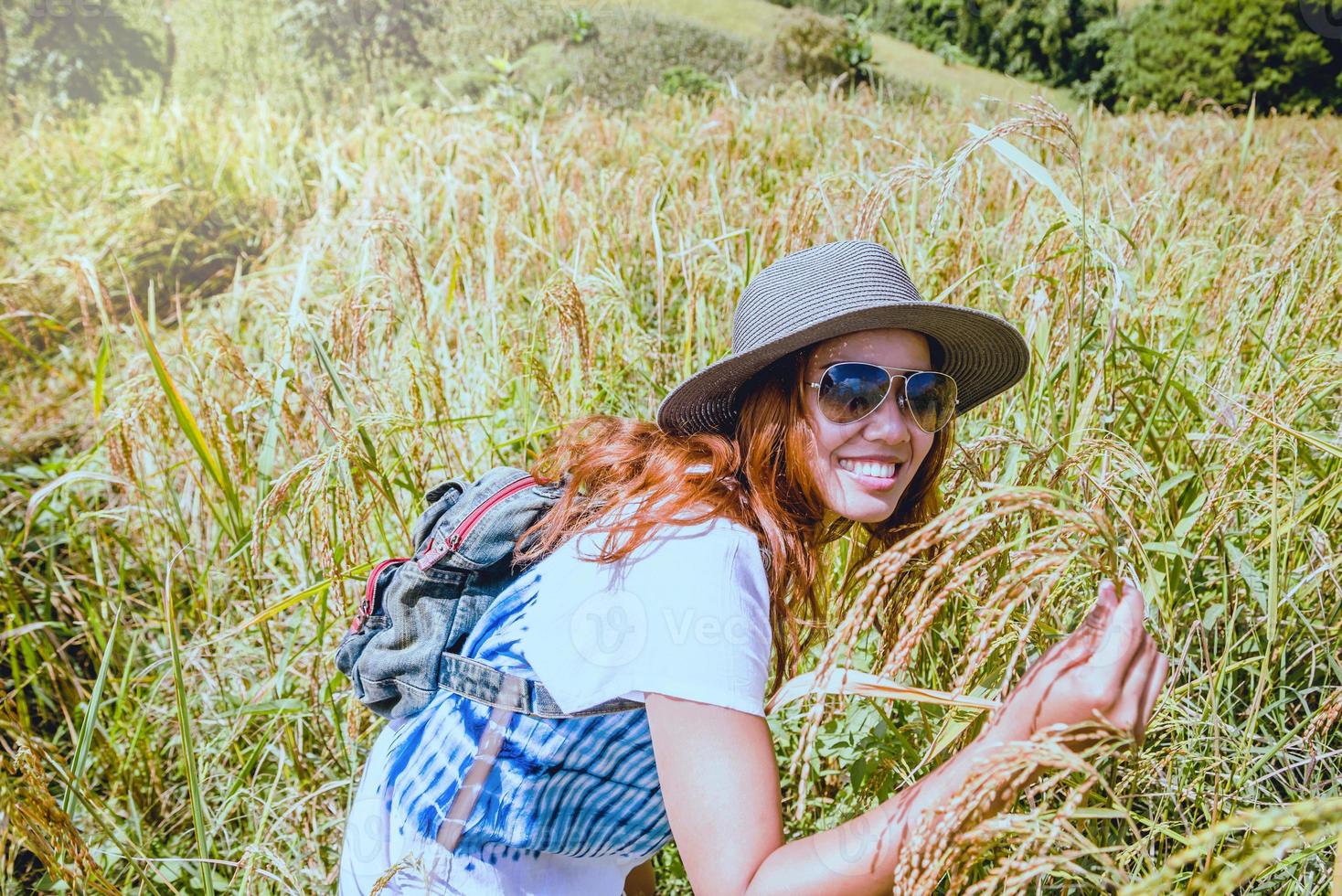 Asian women travel relax in the holiday. Stand natural touch mountain field. Thailand photo