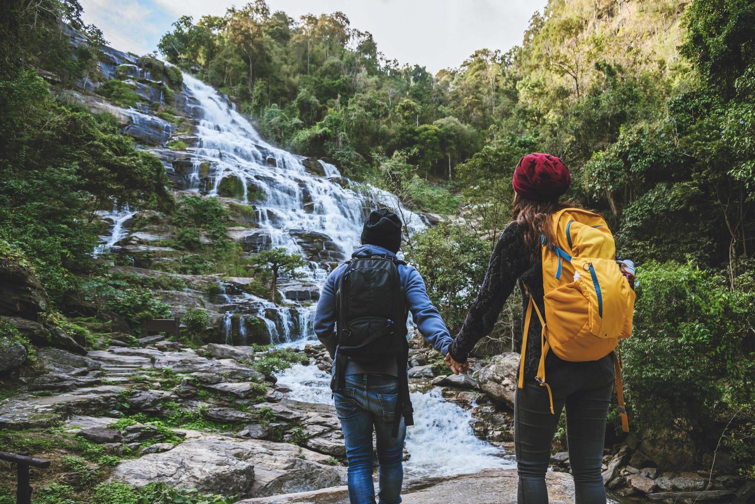 Travel relax to visit the waterfalls of couples. In the winter. at the waterfall mae ya chiangmai in thailand. travel nature. summer photo