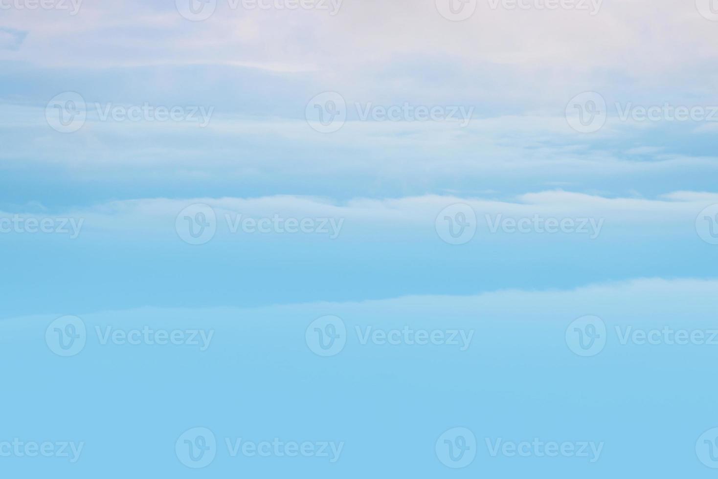 blue sky with light blue white clouds. sunshine day with orange sky in evening background photo