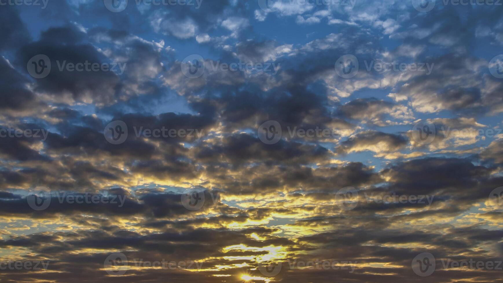 Beautiful yellow and blue sky evening beauty and Clouds at sunset , dawn, the rays of the sun break through the clouds. Natural photo