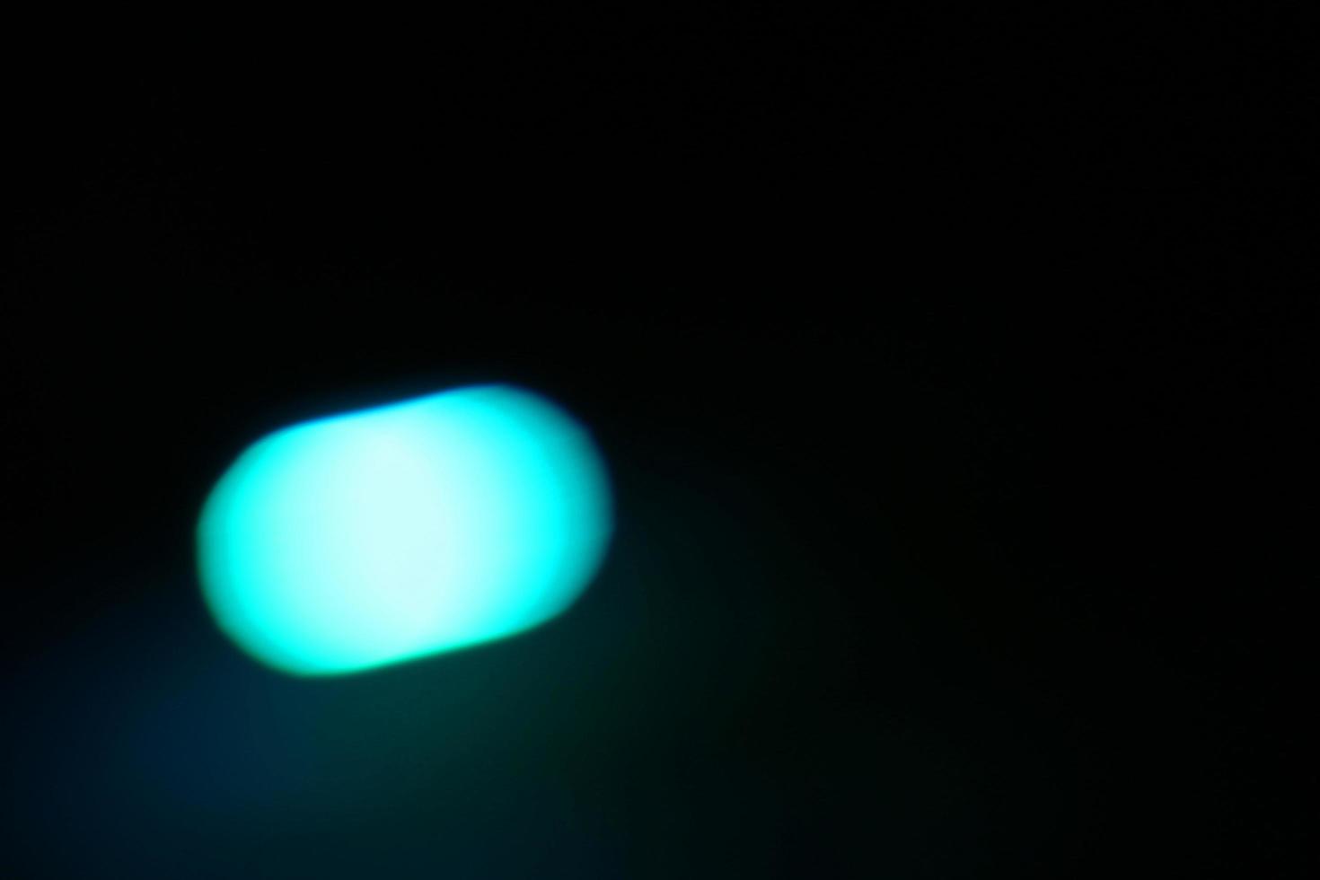 Abstract blur light background.light blue decorating light.abstract light.Beautiful light blue on black photo