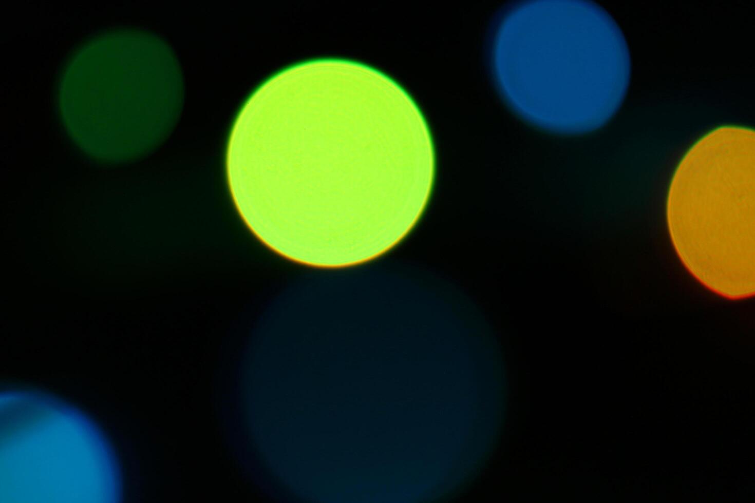 Abstract blur light background.blue and yellow and green decorating light.abstract light.Beautiful blue and yellow and green on black photo