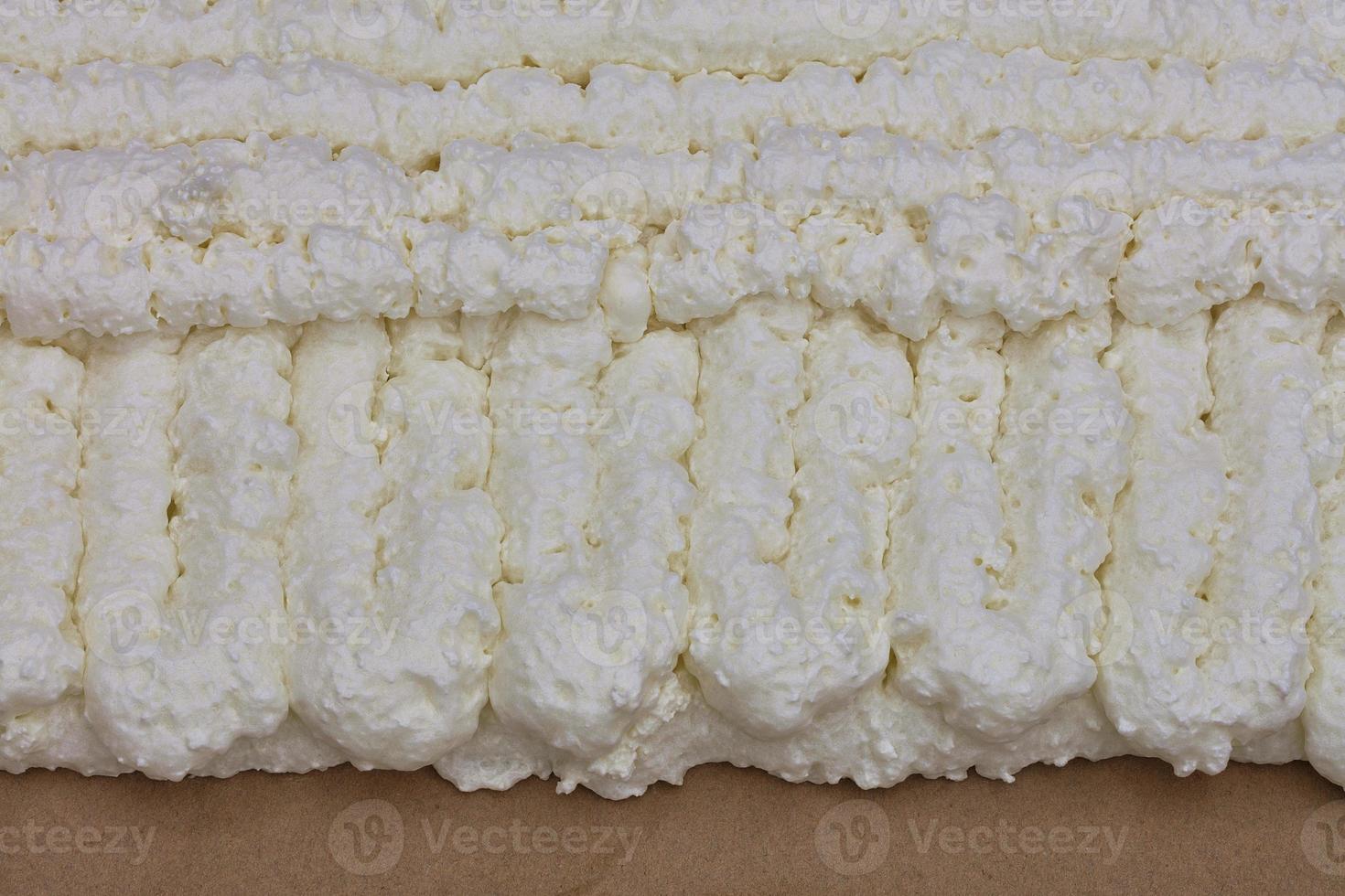 Texture and background of the wall of construction foam laid on a cardboard photo