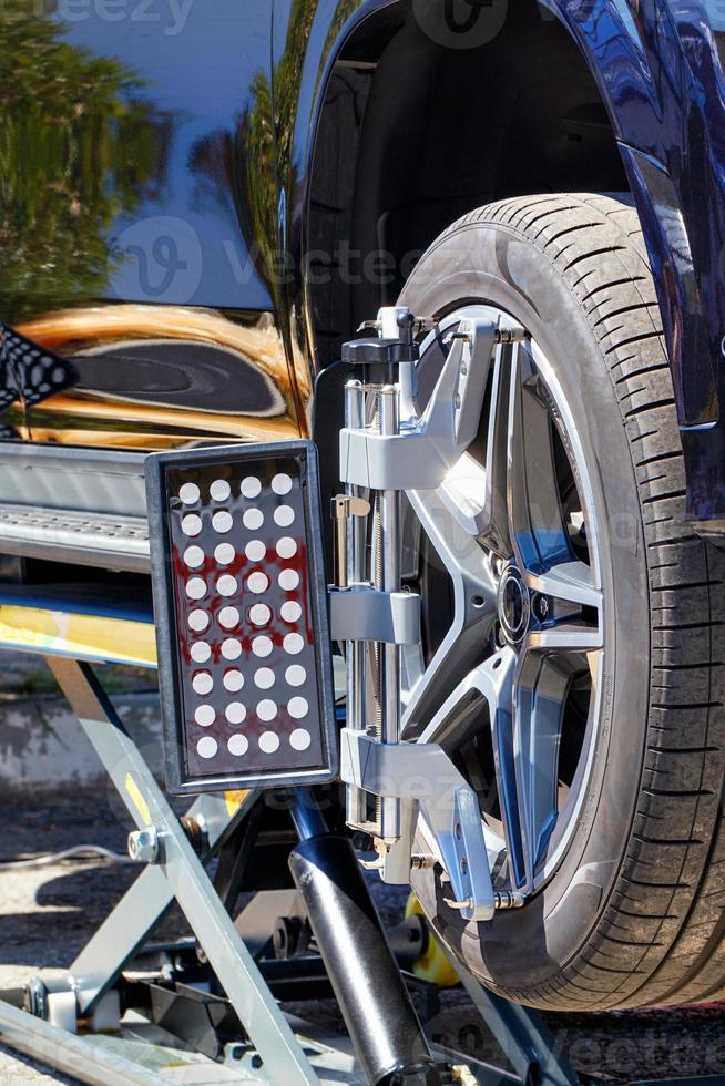 Fragment of a mobile installation for adjusting the camber and wheel mounting angles. photo