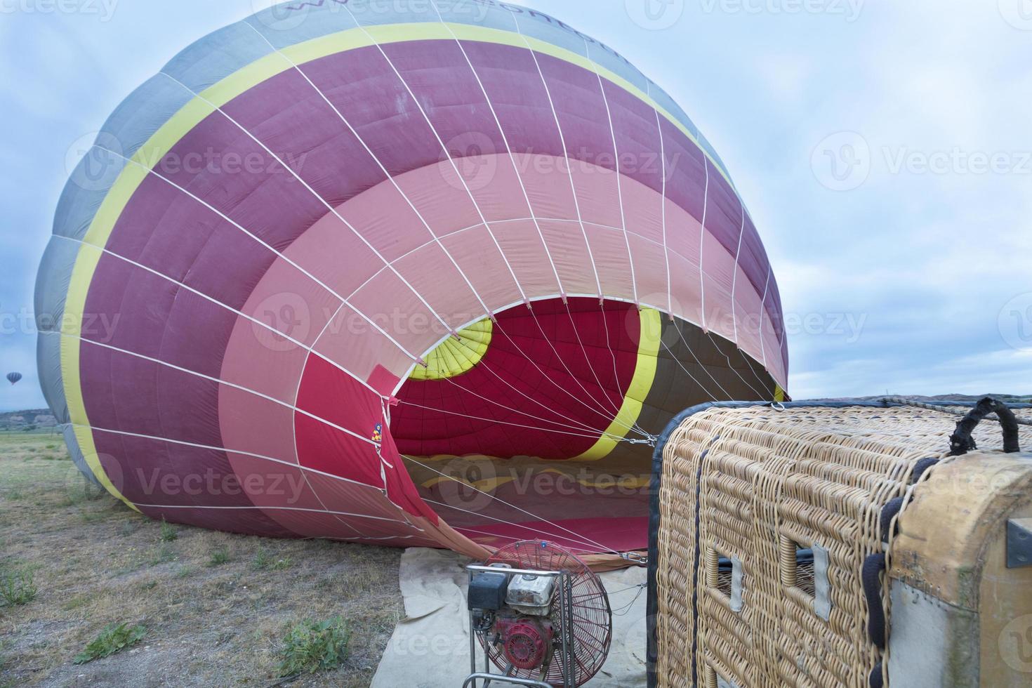 Cappadocia, Goreme, Turkey. The process of inflating hot air balloons photo