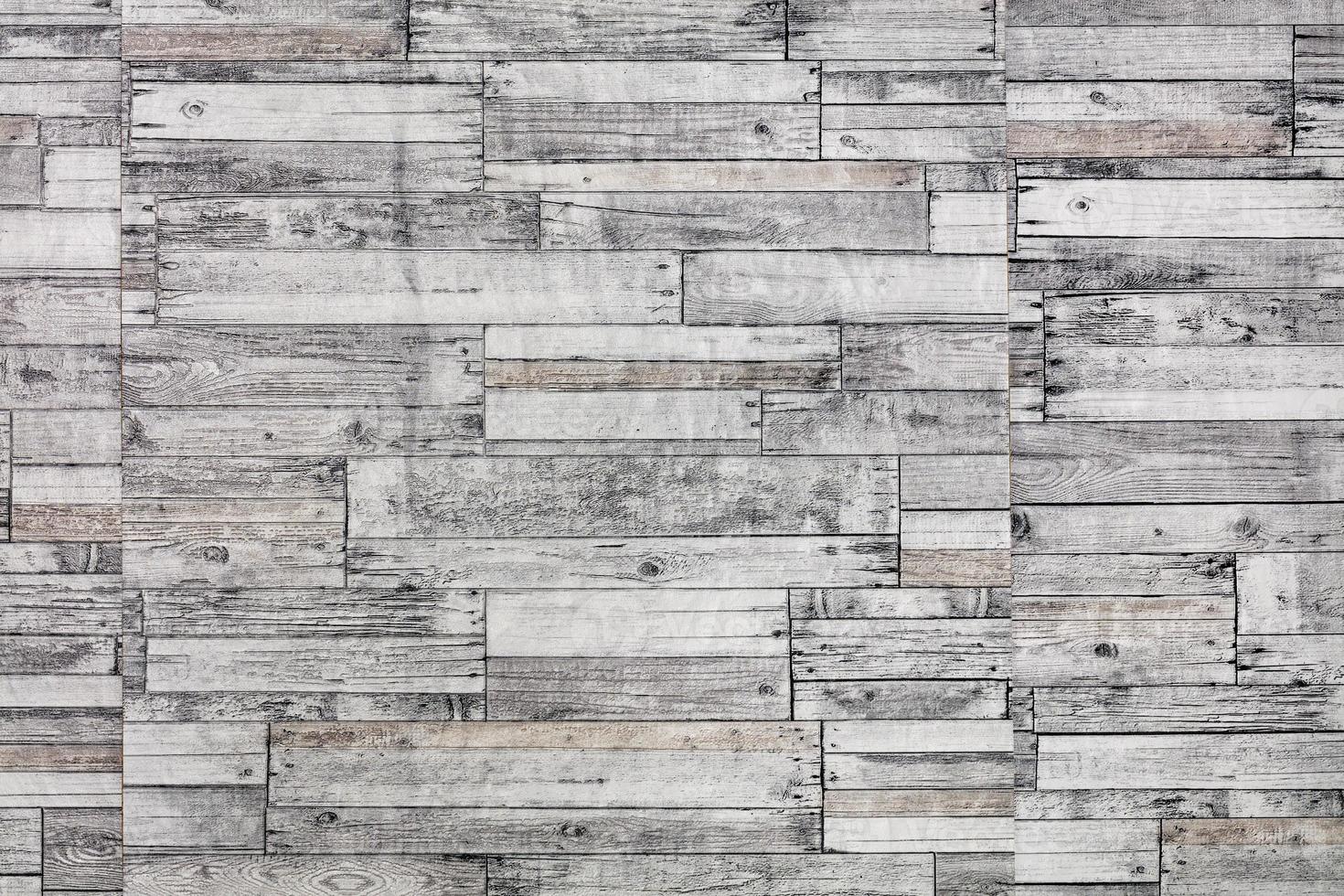 Wooden mosaic wall. Mosaic of gray old wooden slats. photo