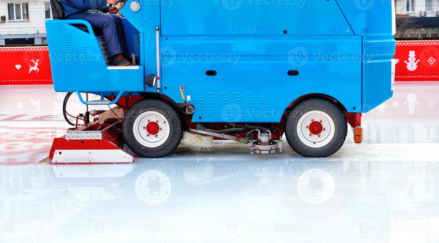 An industrial machine cleans the ice rink at the stadium. photo