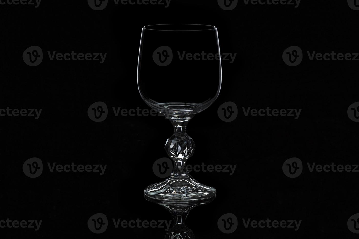 glass wine glass isolated on a black background photo