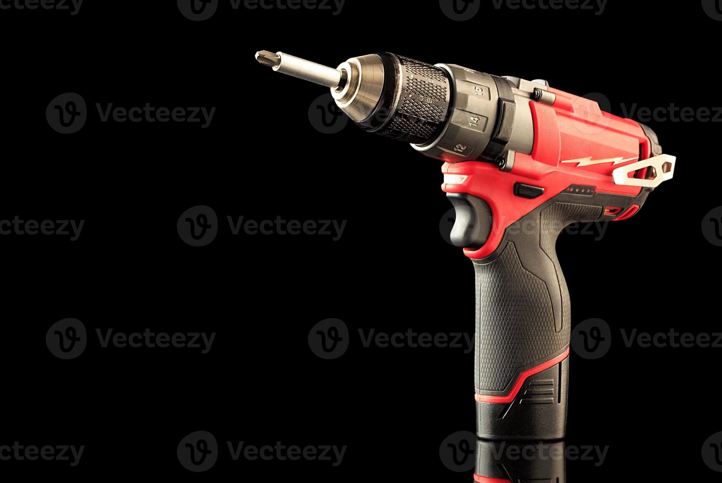 Cordless drill screwdriver isolated on black background photo