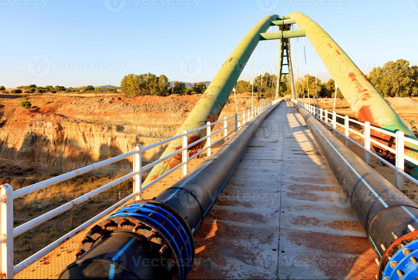 Pedestrian metal arch bridge over the Strait of Corinth. photo