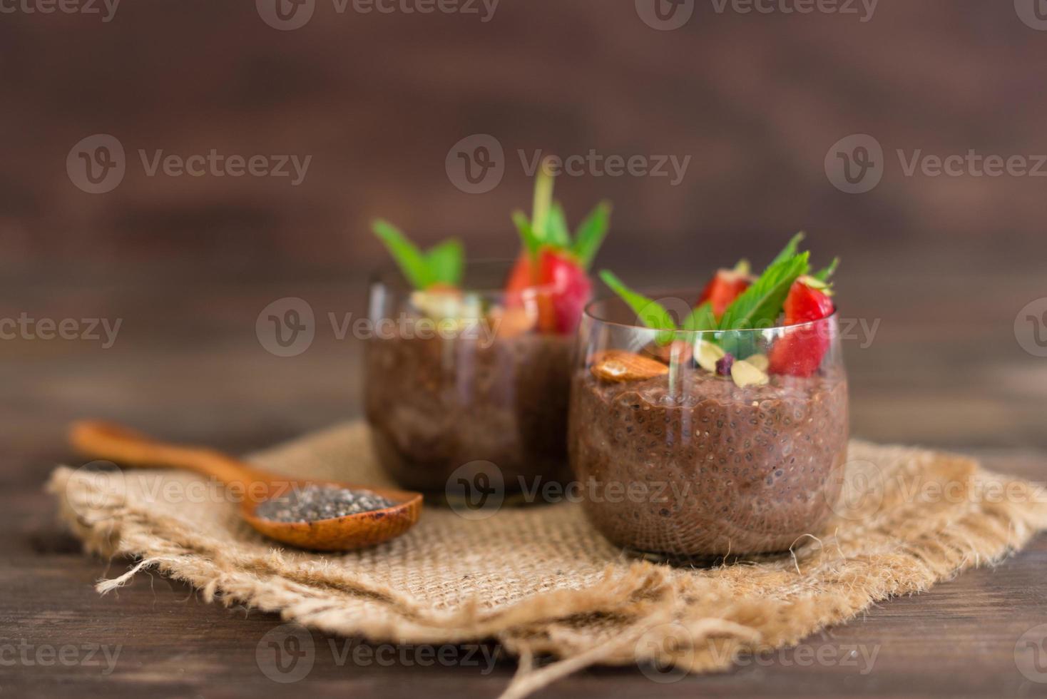 Chia pudding with cocoa, chocolate and nuts in almond milk photo