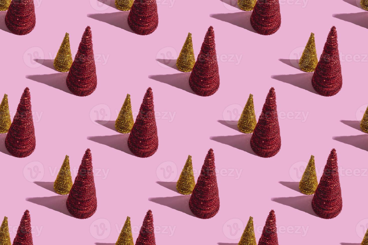 Colored Christmas trees on a pink background. Christmas concept, seamless pattern photo
