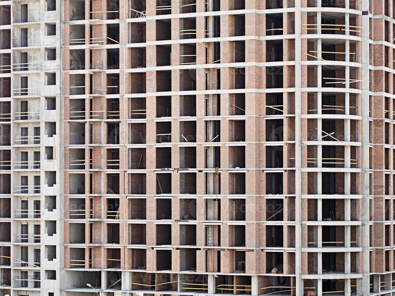 Monolithic frame construction on facade - building under construction. photo