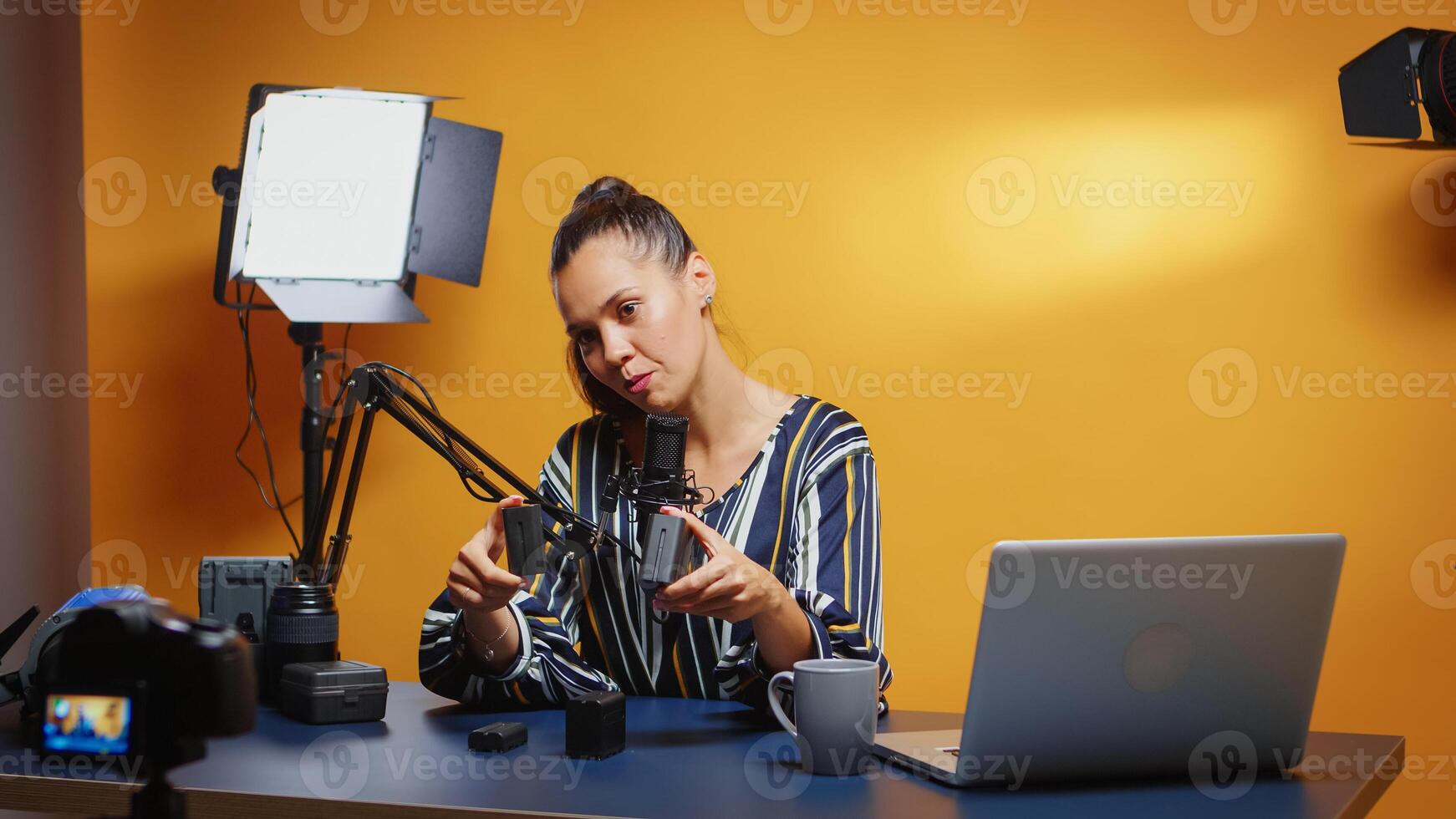 Different Np-f style batteries on vlogger desk photo