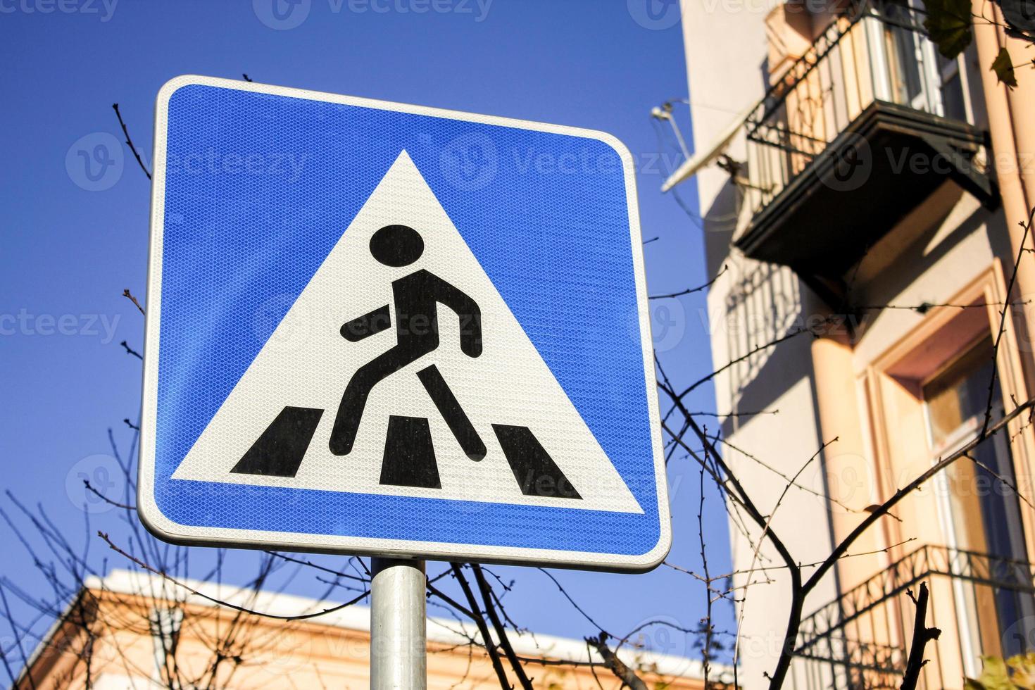 Zebra crossing road sign under the bright sunlight. photo