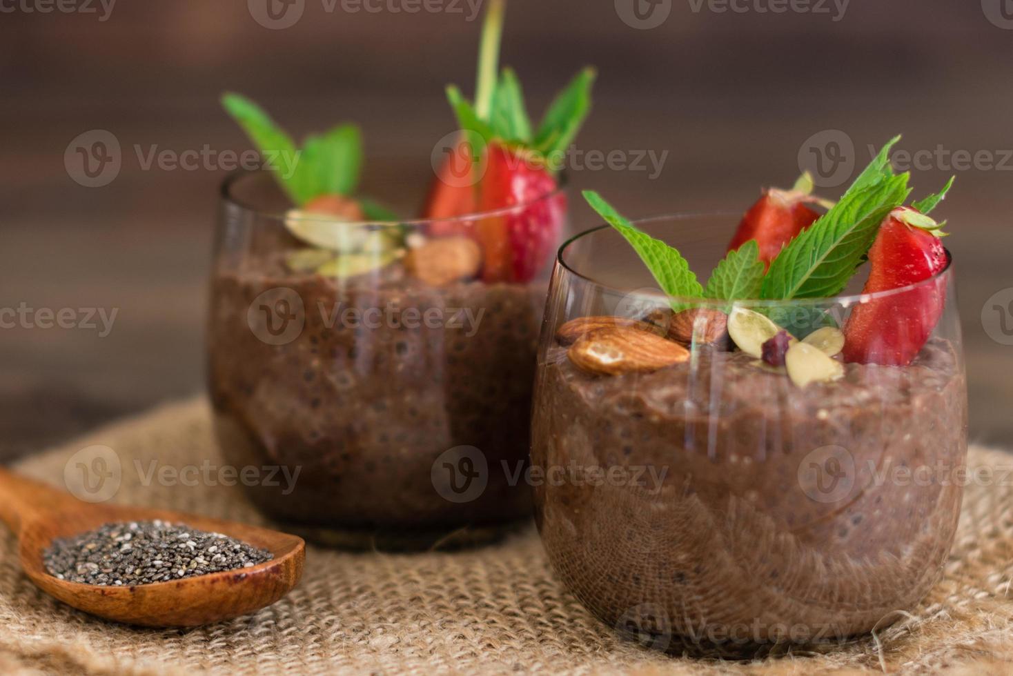 Chia pudding with cocoa, chocolate and nuts in almond milk photo