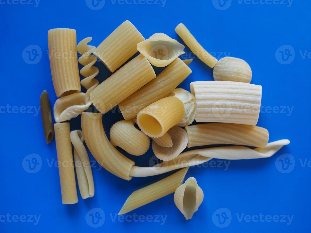 Traditional Italian pasta, blue background photo