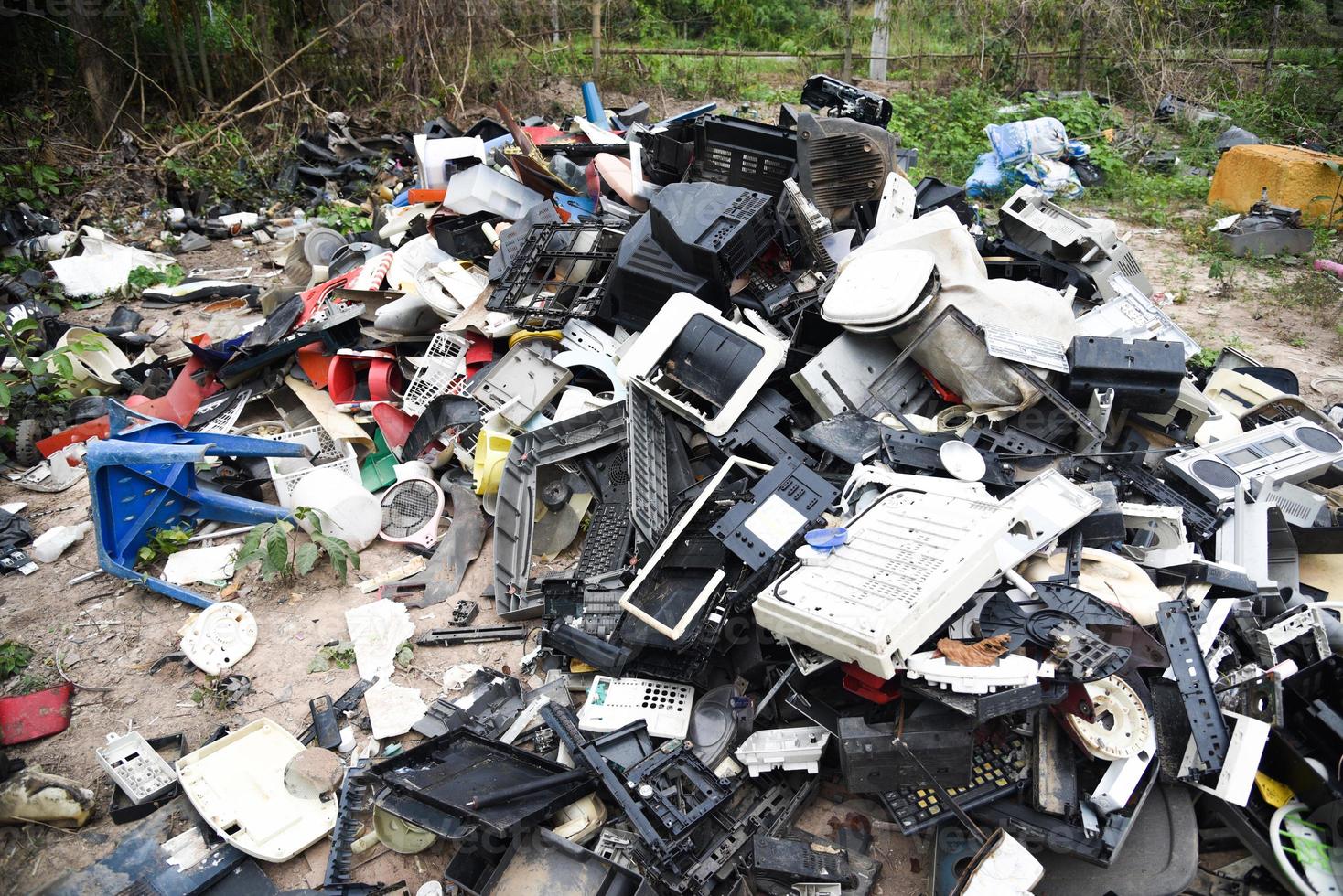 Electronic waste ready for recycling, Pile of used electronic and housewares waste division broken or damage garbage photo