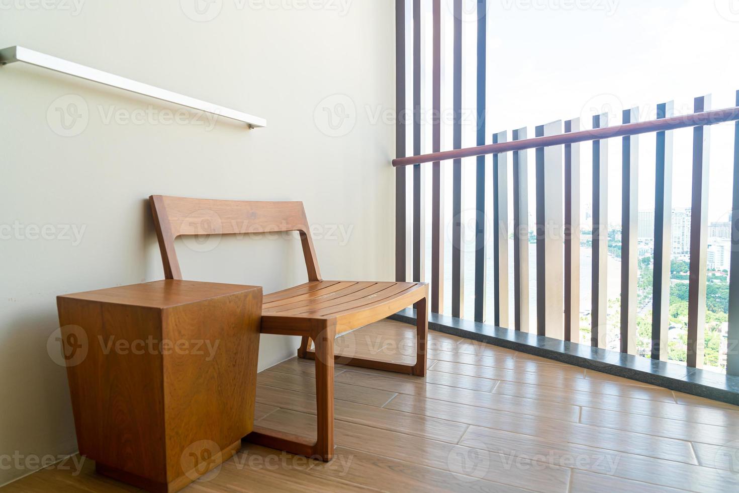 wood bench on a balcony photo