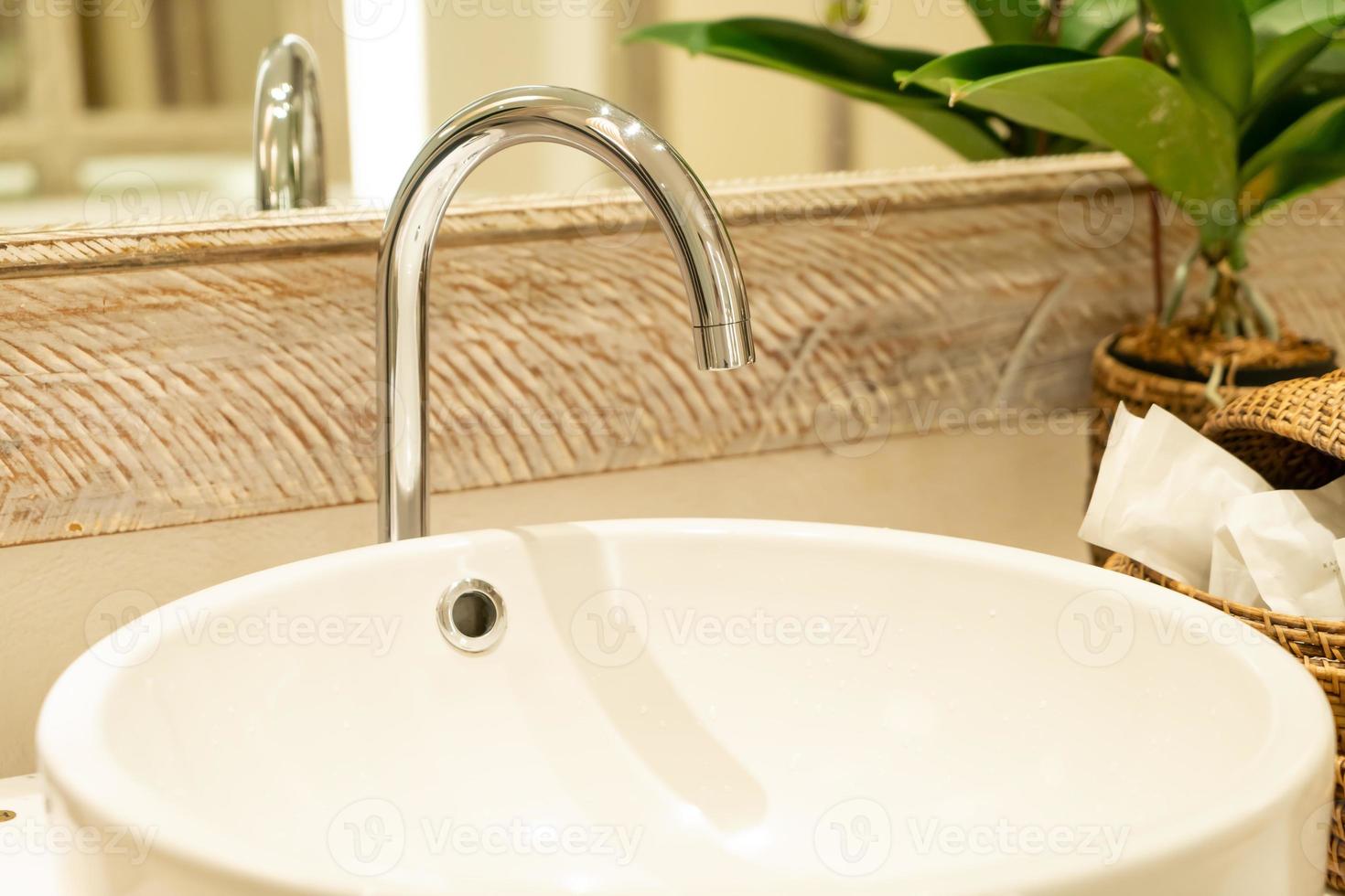 Water faucet in bathroom photo
