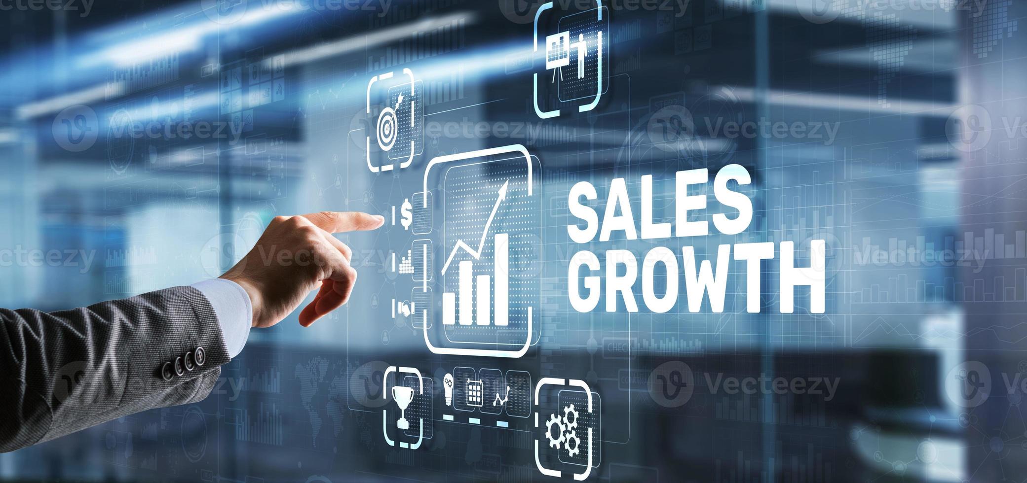 Sales Growth Man clicks inscription on virtual 3D screen photo