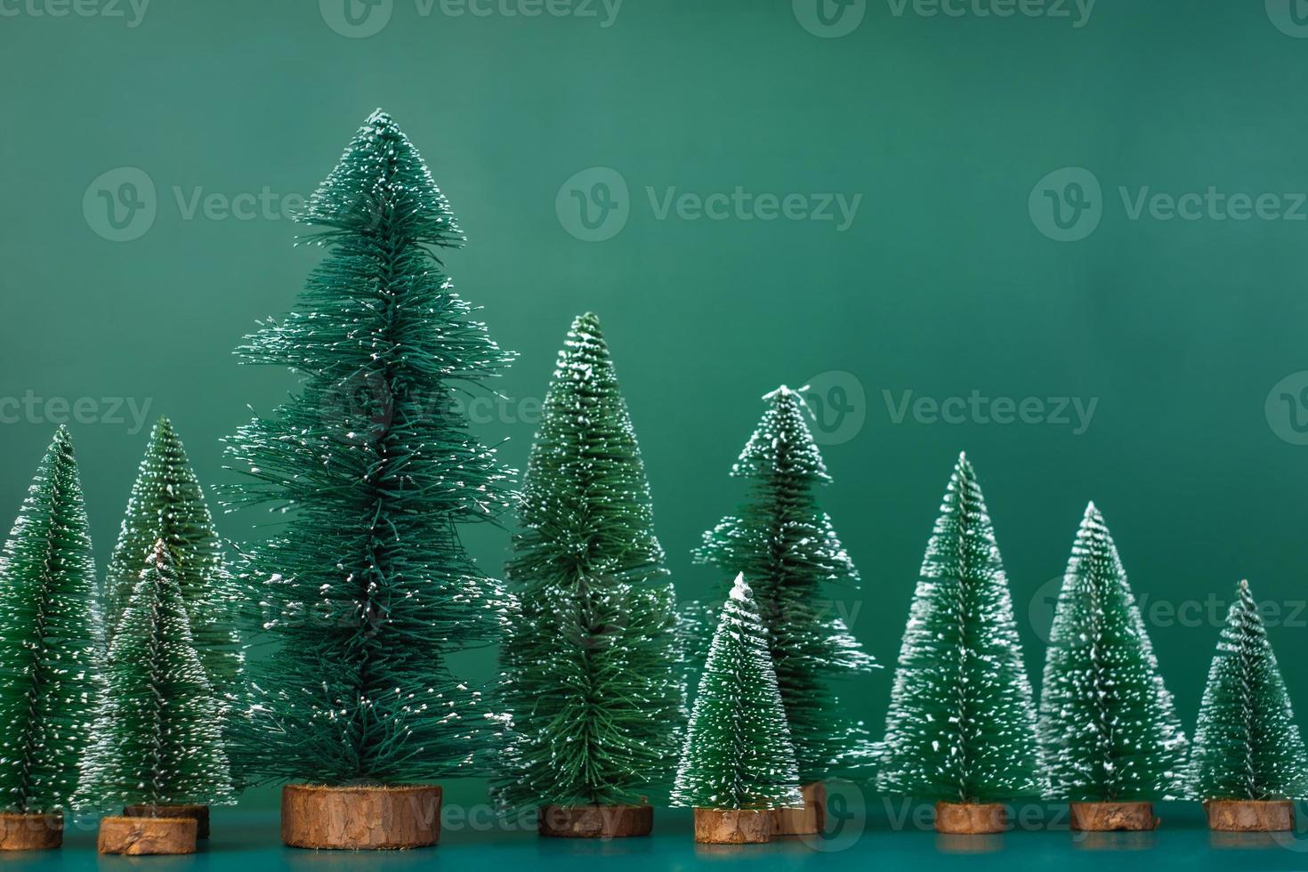 christmas tree group on green background. photo