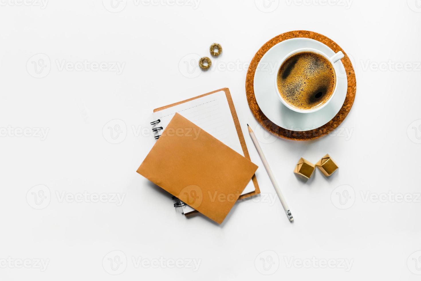 Tasty aroma coffee on white desk with paper. photo