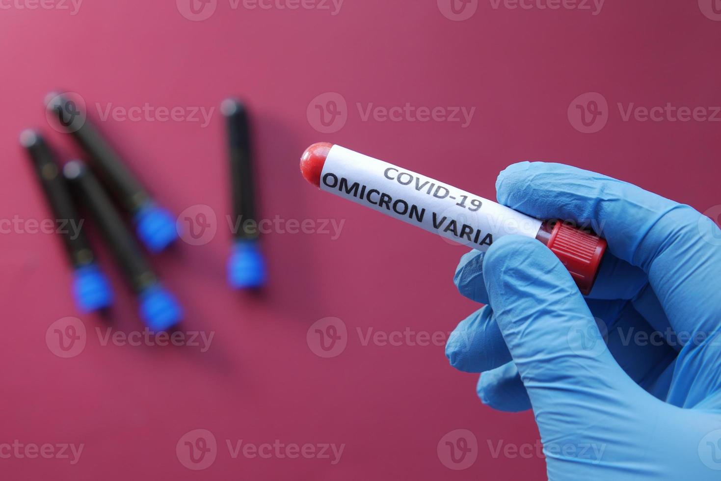 hand hold omicron variant corona virus blood test tube photo