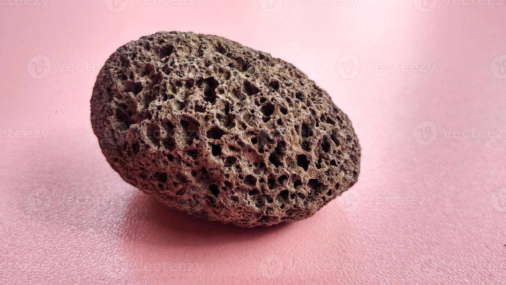 Oxide Scoria specimen, brown, rounded and weighs light , is a volcanic rock that consists of highly vesicular rough textured volcanic glass, which may or may not contain crystals, Indonesia Mountain photo