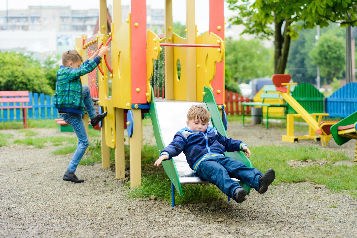 Funny children play on a children's playground photo