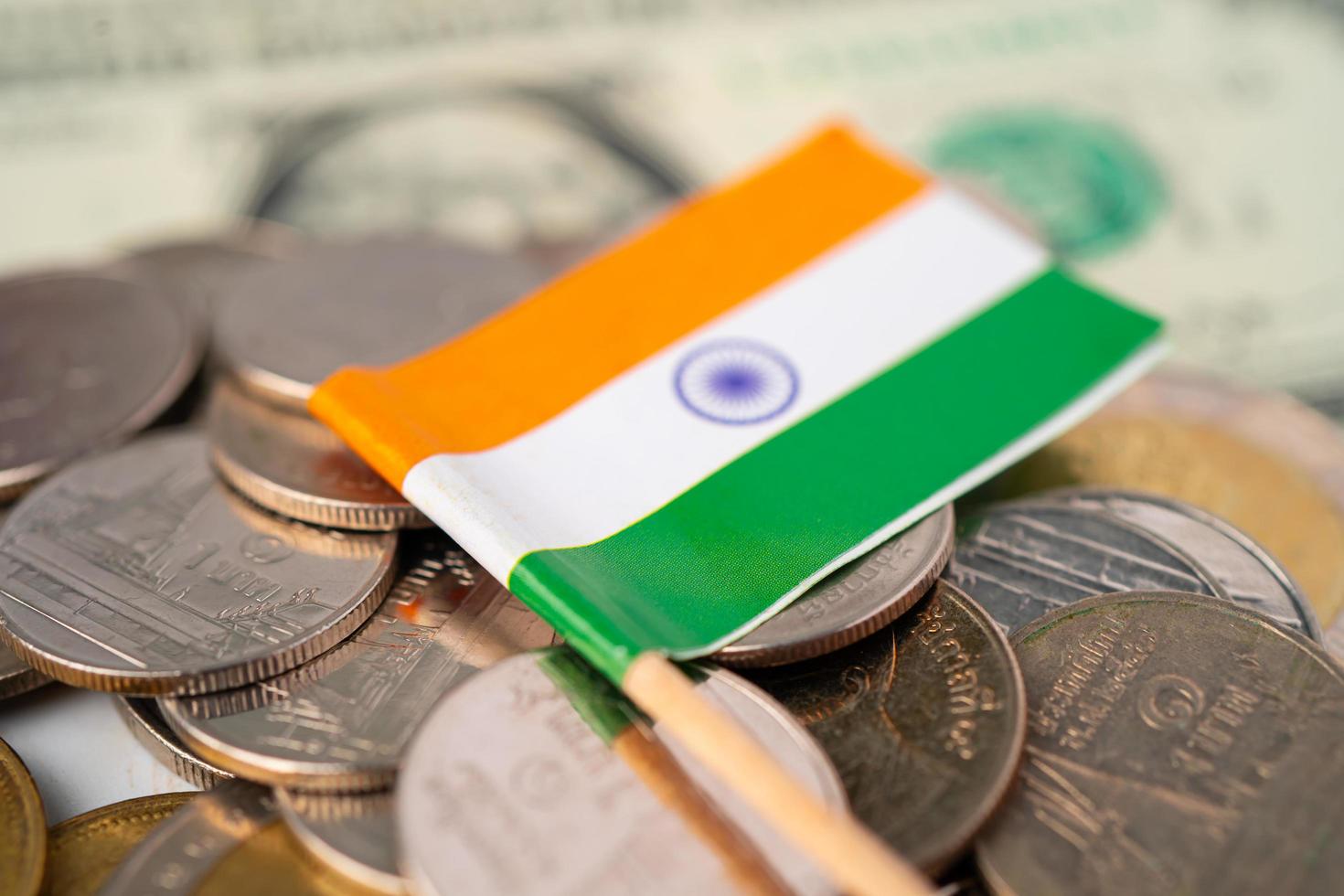 Stack of coins with India flag on white background. photo