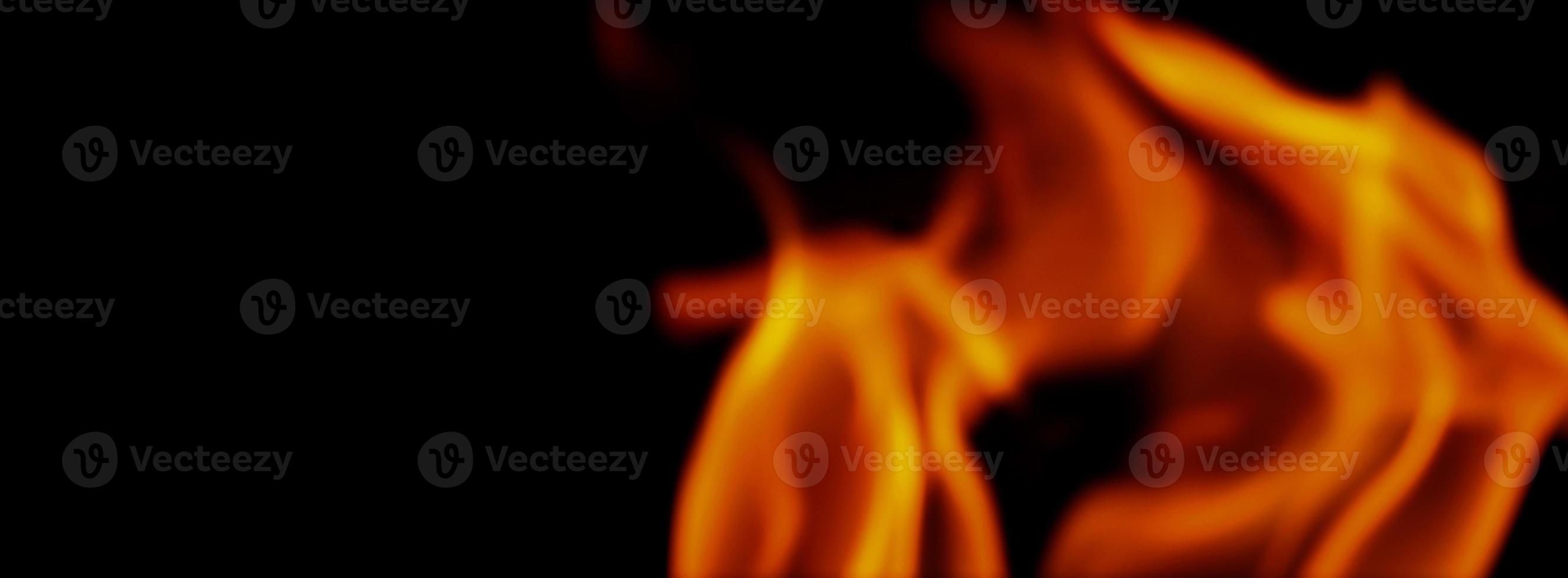 Fire background. Abstract burning flame and black background. photo
